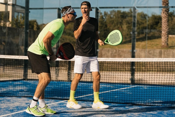 padel doubles strategy teamwork on court